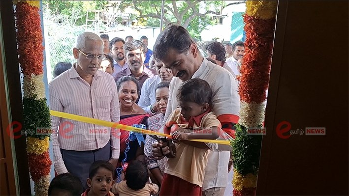 Government officials and local residents cutting the ribbon to inaugurate a new 17 lakh Anganwadi center at Milaguparai Veduvar Street in Trichy on June 12 2026