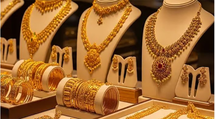 A close-up shot of heavy gold jewelry and silver bars displayed inside a retail showroom in Chennai during the sudden price hike on June 12 2026.