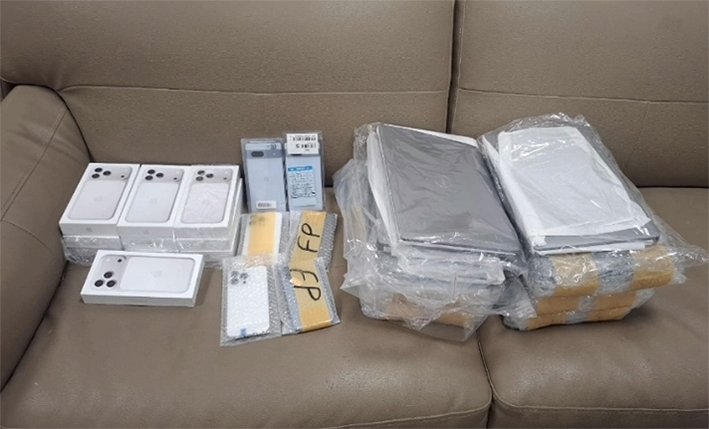 : Indian Customs and Air Intelligence Unit officers inspecting seized cartons of foreign cigarettes at Tiruchirappalli International Airport in June 2026