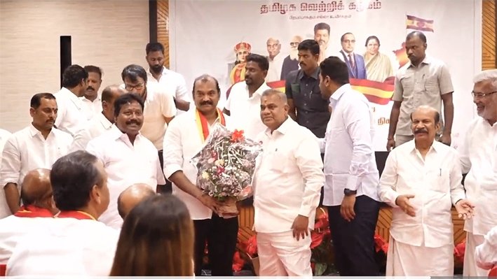Trichy political leader Senthilnathan presenting a bouquet to TVK Chief Vijay at the party office in Panaiyur in June 2026.