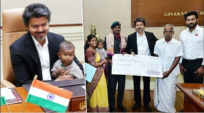 Popular Tamil actor and TVK Chief Thalapathy Vijay holding a newborn baby of an Indian army soldier with a warm smile in 2026.