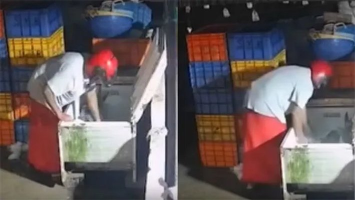 சந்தையில் ஹெல்மெட் அணிந்து மீன் திருடிய மர்ம ஆசாமி